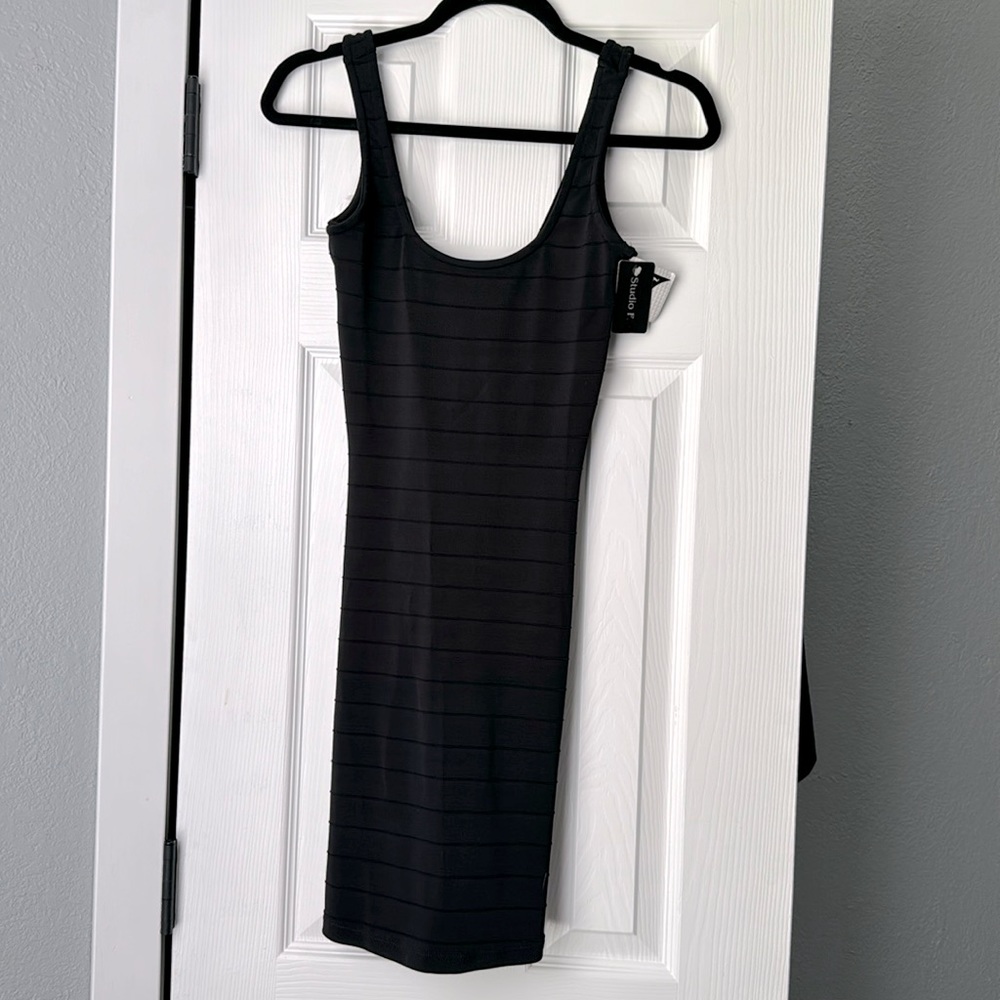 Studio F Black SMALL size 10 dress would fit a size 6.